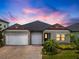 Charming single-story home with a three-car garage and well-maintained landscaping at 21648 Snowy Orchid Ter, Land O Lakes, FL 34637