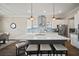 Bright kitchen showcasing a large island, stylish pendant lighting, and stainless steel appliances at 21648 Snowy Orchid Ter, Land O Lakes, FL 34637