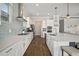 Bright kitchen showcases quartz counters, stainless appliances, and a stylish backsplash at 21648 Snowy Orchid Ter, Land O Lakes, FL 34637