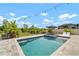 Beautiful swimming pool with spa and lounge chairs, perfect for outdoor relaxation and entertaining at 21648 Snowy Orchid Ter, Land O Lakes, FL 34637