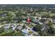 Birds eye view showcasing neighborhood homes and a nearby golf course at 2287 Demaret Dr, Dunedin, FL 34698