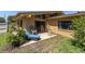 Charming backyard patio with outdoor seating, ideal for relaxing and entertaining at 2287 Demaret Dr, Dunedin, FL 34698