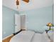 Comfortable bedroom with hardwood floors and an ensuite bathroom at 2287 Demaret Dr, Dunedin, FL 34698