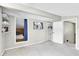 Bedroom with built-in shelves and window to other room allowing natural light to filter through at 2287 Demaret Dr, Dunedin, FL 34698
