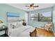 Cozy bedroom with hardwood floors and a large window at 2287 Demaret Dr, Dunedin, FL 34698