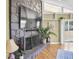Living room with stone fireplace and modern decor at 2287 Demaret Dr, Dunedin, FL 34698