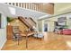 Inviting living room with hardwood floors, a cozy fireplace, and an abundance of natural light at 2287 Demaret Dr, Dunedin, FL 34698