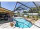 View of screened pool, lanai, and lounge area for outdoor relaxation and entertainment at 2287 Demaret Dr, Dunedin, FL 34698