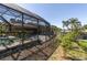 A screened-in pool area with a partially obstructed view of the pool at 2287 Demaret Dr, Dunedin, FL 34698