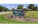 Fairway Estates community sign is surrounded by lush landscaping and shows neighborhood pride at 2287 Demaret Dr, Dunedin, FL 34698