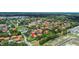 Aerial view showcasing a community of condos with picturesque ponds at 2412 Hammock Pine Blvd, Clearwater, FL 33761