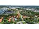 Aerial view of a condo community, featuring lush landscaping and waterways at 2412 Hammock Pine Blvd, Clearwater, FL 33761