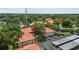 Overhead view of condo buildings with covered parking and a pond nearby at 2412 Hammock Pine Blvd, Clearwater, FL 33761
