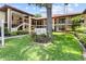 Beautiful condo complex with manicured lawns and lush landscaping at 2412 Hammock Pine Blvd, Clearwater, FL 33761