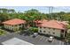 Condo building featuring covered parking and well-maintained landscaping at 2412 Hammock Pine Blvd, Clearwater, FL 33761