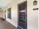 The building has a covered walkway with dark trim and unit numbers at 2412 Hammock Pine Blvd, Clearwater, FL 33761