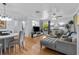Inviting living room featuring modern furnishings, an open layout, hardwood floors, and soft, natural light at 2412 Hammock Pine Blvd, Clearwater, FL 33761