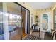 Cozy screened patio with outdoor seating, overlooking the backyard, creates a perfect spot for relaxation and entertaining at 2412 Hammock Pine Blvd, Clearwater, FL 33761