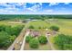 Expansive estate features lush green pastures, multiple buildings, and a private setting at 2502 Fritzke Rd, Dover, FL 33527