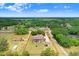 Aerial view highlighting the home's generous lot, pool, and outdoor living space within a charming neighborhood setting at 2502 Fritzke Rd, Dover, FL 33527