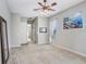 Carpeted bedroom offers ceiling fan, natural light, and a soothing color palette perfect for relaxation at 2502 Fritzke Rd, Dover, FL 33527