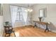 Elegant dining room featuring hardwood floors, chandelier, and ample natural light at 2502 Fritzke Rd, Dover, FL 33527