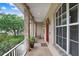 Charming front porch with brick columns, providing an inviting outdoor space to relax and enjoy at 2502 Fritzke Rd, Dover, FL 33527