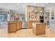 Well-appointed kitchen with an island, granite countertops, and stainless steel appliances at 2502 Fritzke Rd, Dover, FL 33527