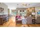 Open living room offers a cozy fireplace, hardwood floors, and lots of natural light at 2502 Fritzke Rd, Dover, FL 33527