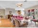 Bright living room with hardwood floors, comfortable seating, and natural light from patio doors at 2502 Fritzke Rd, Dover, FL 33527