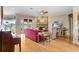 Inviting living room with brick fireplace, hardwood floors, and natural light at 2502 Fritzke Rd, Dover, FL 33527