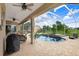 Backyard pool with a large screened lanai, spa, and ample seating for outdoor entertaining at 2502 Fritzke Rd, Dover, FL 33527