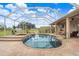 Large backyard swimming pool and screened in lanai, creating a relaxing outdoor space at 2502 Fritzke Rd, Dover, FL 33527