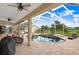 Spacious backyard pool and patio area with covered lanai and ample seating at 2502 Fritzke Rd, Dover, FL 33527
