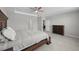 A bright main bedroom showcases a wooden dresser and plenty of natural light at 2512 High Tides Way, Wesley Chapel, FL 33543
