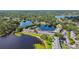 An aerial view of a lakeside neighborhood with multiple buildings next to two scenic lakes at 2557 Cedar Cypress Ct, Tampa, FL 33618