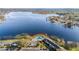 Scenic aerial view of the lake community with a swimming pool, condo buildings, and natural surroundings at 2557 Cedar Cypress Ct, Tampa, FL 33618