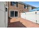 Private patio featuring brick paving, enclosed fencing and access to yard and rear of the building at 2557 Cedar Cypress Ct, Tampa, FL 33618
