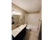 This bathroom includes a tub and shower combo, vanity with sink, and light fixture at 2557 Cedar Cypress Ct, Tampa, FL 33618