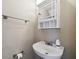 Charming powder room with pedestal sink, mirrored cabinet, and chrome fixtures at 2557 Cedar Cypress Ct, Tampa, FL 33618