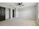 Bright bedroom featuring ample closet space, a ceiling fan, and natural light at 2557 Cedar Cypress Ct, Tampa, FL 33618