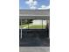 This parking spot offers a covered carport with views of the lake at 2557 Cedar Cypress Ct, Tampa, FL 33618