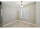 Bright dining area features tile flooring, modern lighting, and a window with natural light at 2557 Cedar Cypress Ct, Tampa, FL 33618