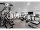 Well-equipped gym with various machines for cardio and strength training, featuring ample lighting at 2557 Cedar Cypress Ct, Tampa, FL 33618