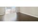 Spacious living area with wood-look flooring and sliding doors to the patio at 2557 Cedar Cypress Ct, Tampa, FL 33618