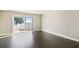 Bright living area with sliding glass doors opening onto the patio and partial lake view at 2557 Cedar Cypress Ct, Tampa, FL 33618