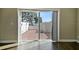 Sliding glass doors opening onto the brick patio with partial lake view at 2557 Cedar Cypress Ct, Tampa, FL 33618