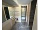 Bathroom with basic fixtures shows the results of demolition and remodeling on the walls and floor at 2621 Cove Cay Dr # 206, Clearwater, FL 33760
