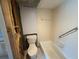 Bathroom featuring a white bathtub and toilet, ready for renovations at 2621 Cove Cay Dr # 206, Clearwater, FL 33760