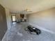 Spacious living room with open floor plan shows exposed concrete and a ceiling fan at 2621 Cove Cay Dr # 206, Clearwater, FL 33760